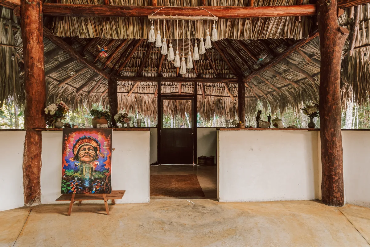 The ceremonial temple at Casa Arkaana — handcrafted wooden structure open to the jungle canopy