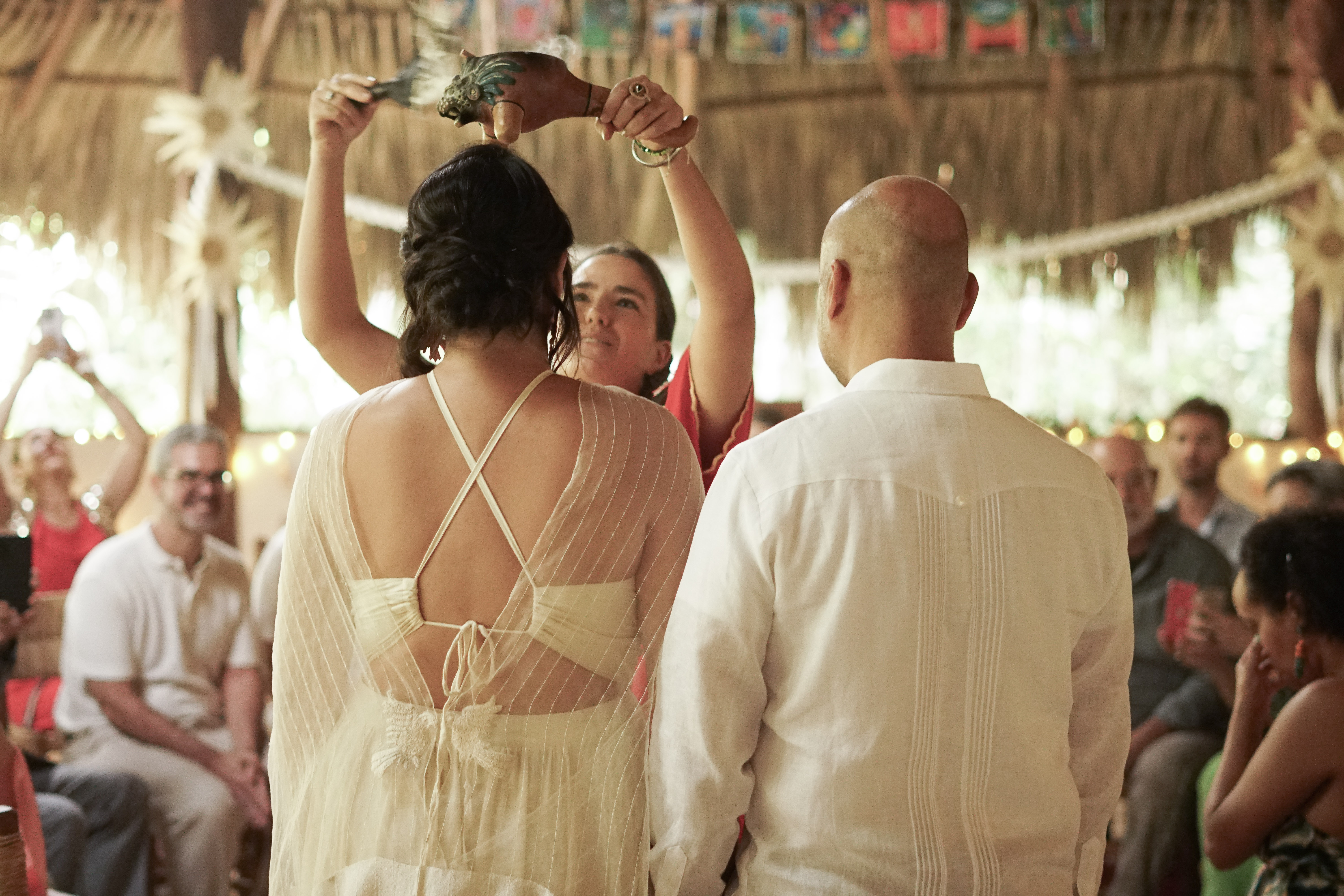 Bride and groom laughing together during their jungle ceremony at Casa Arkaana