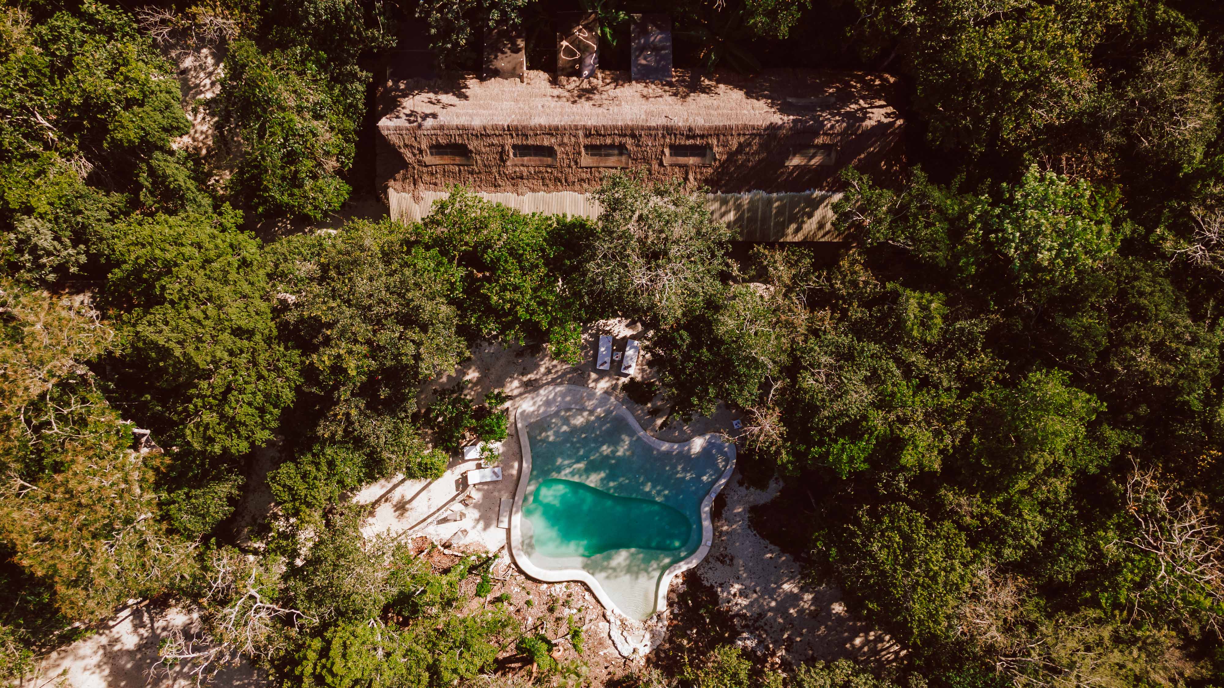 Aerial view of Casa Arkaana nestled in the Tulum jungle